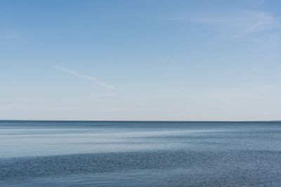 blue sea with calm water against sky in summertime
