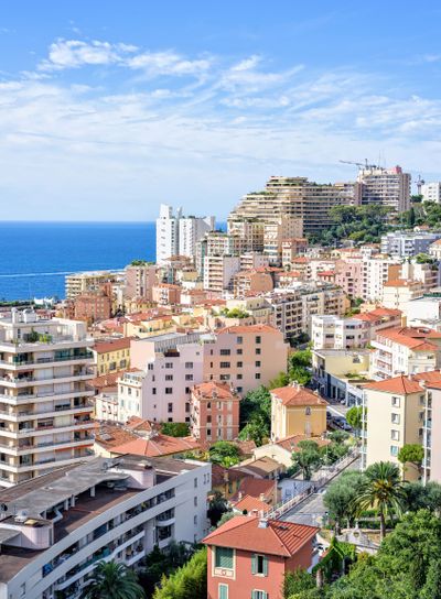 Daylight view to tall city buildings, old town and blue...