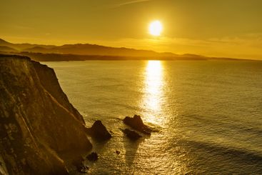 Asturias coast. Sunset over Cabo Busto cliffs, Spain.
