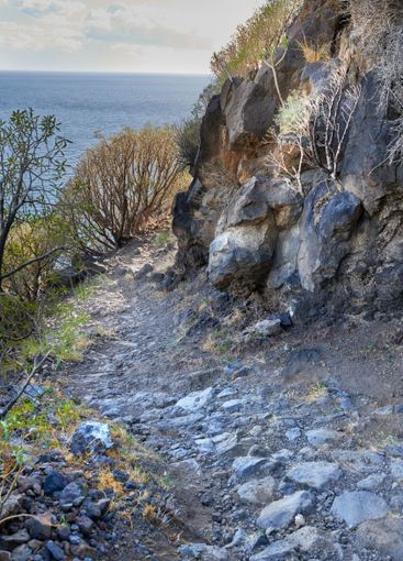 Rock, nature and sea with trail on mountain for hiking,...