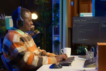 African american computer scientist in home office...