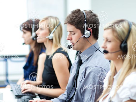 Attractive young man working in a call center