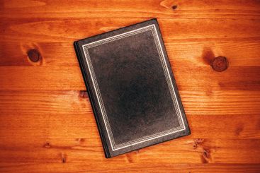 Top view of old vintage hardcover book front cover as...