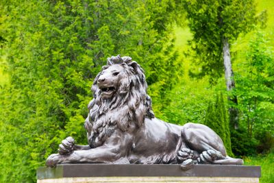 Black lion sculpture in Linderhof Palace park, Bavaria,...