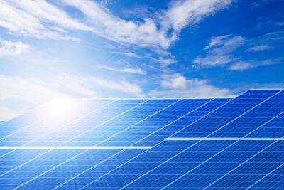 sun light and solar cell panels  against beautiful clear...