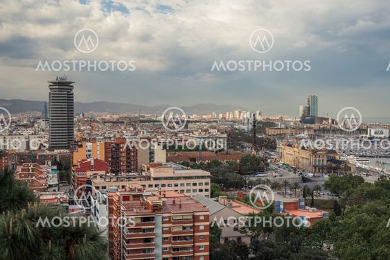 Barcelona city under cloudy sky overview