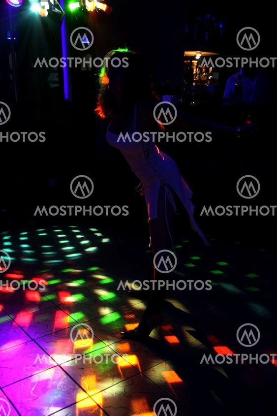 silhouette of a dancing girl in a white dress in the...