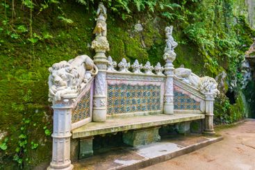 Old romantic bench at park of Quinta da Regaleira palace...