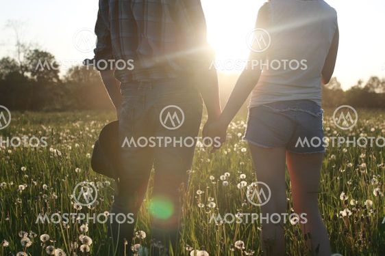 Cute couple on a walk by the countryside