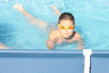 boy with goggles represents a moment of pure childhood...