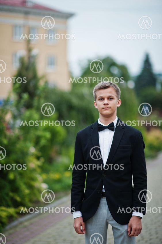 Portrait of a handsome young man in formal fancy suit...