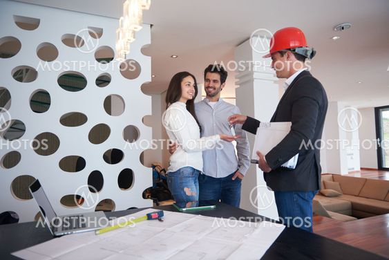 couple buying new home with real estate agent