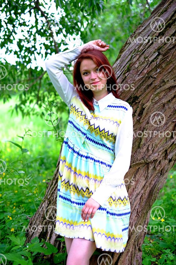 The girl near a tree