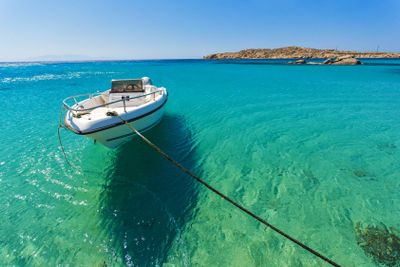 Clear waters of Paranga Beach on the island of Mykonos,...