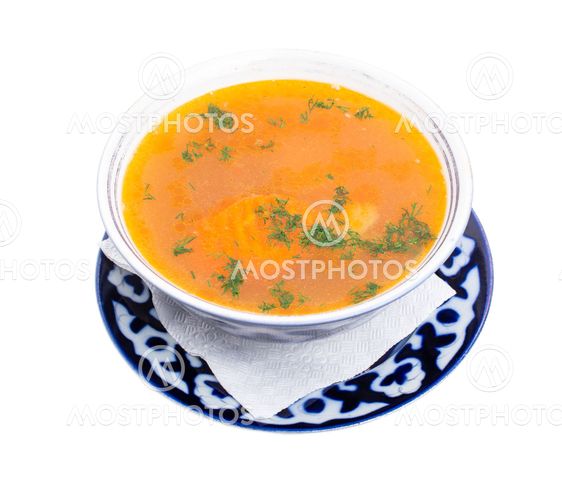 Traditional uzbek dumpling soup with sour cream.