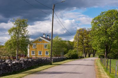 Old, yellow painted farmhouse in Sweden