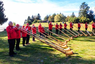 Traditional swiss alphorn players on Cardada, Switzerland