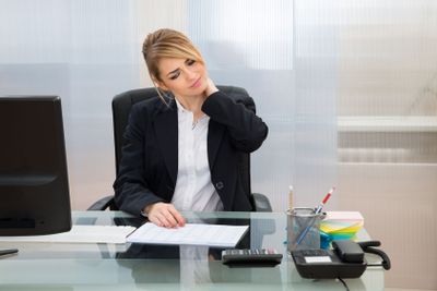 Young Businesswoman Suffering From Neckache