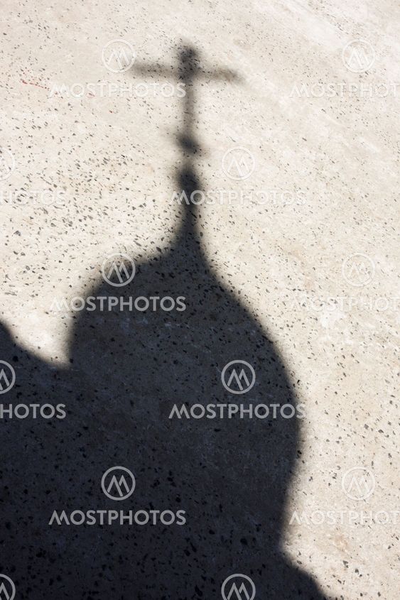 shadow on the pavement of church