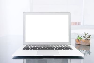 laptop computer on table in office