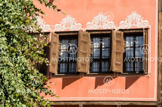 Windows with wooden shutters in the old Plovdiv