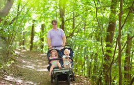 Father with children in all terrain stroller