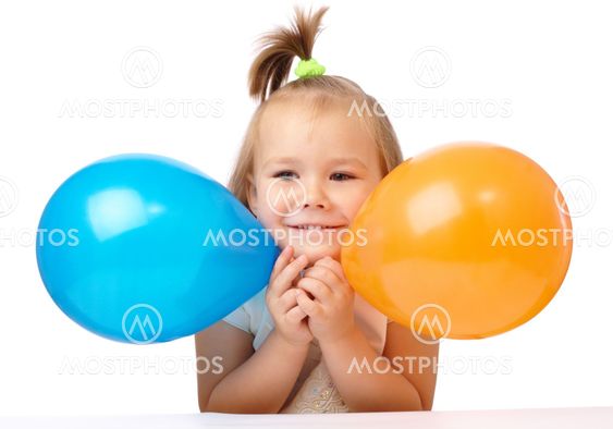 Cute little girl with two colored balloons