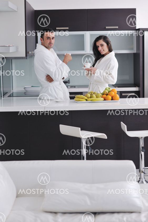 young couple have fun in modern kitchen