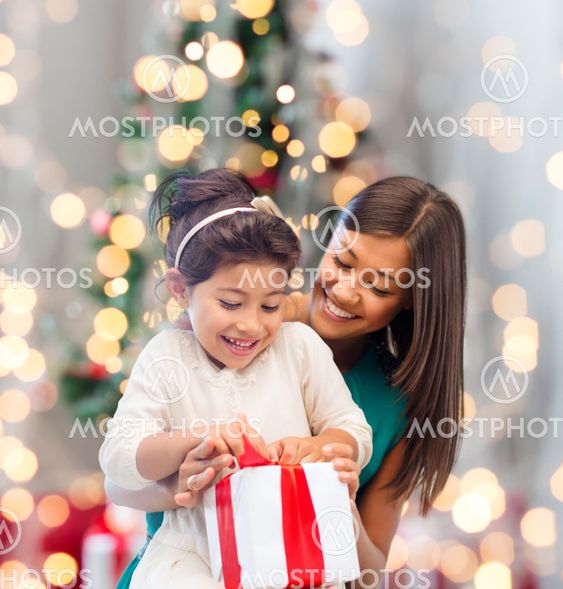 happy mother and little girl with gift box