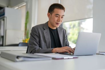 Business man working using laptop computer Hands typing...