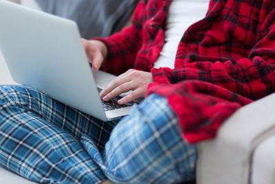 man freelancer in bathrobe working from home