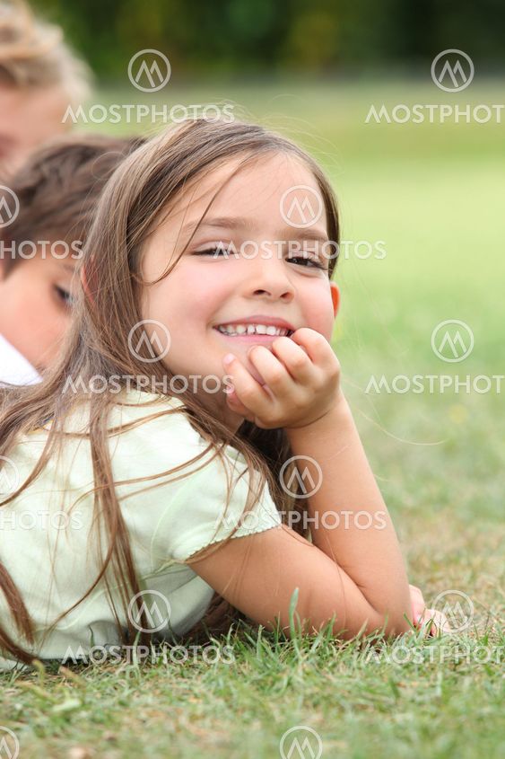 Girl lying in the grass