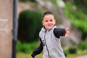 Children playing together in a park or engaging in a game.