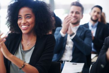 Professional woman, group and applause at conference for...