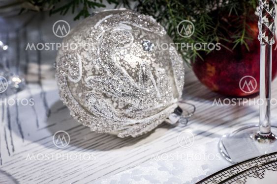 Silver christmas tree ball decoration on white table