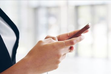 Hands, business and woman in office, smartphone and...