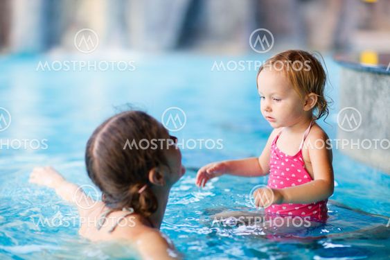 Mother and daughter at swimming pool