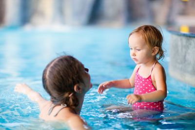 Mother and daughter at swimming pool