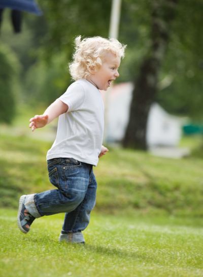 Boy running in garden