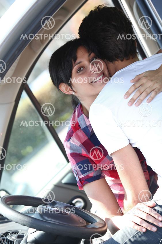 Embracing couple in car