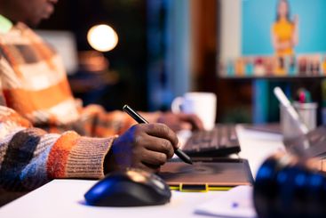 Freelance graphic designer working from home office on...