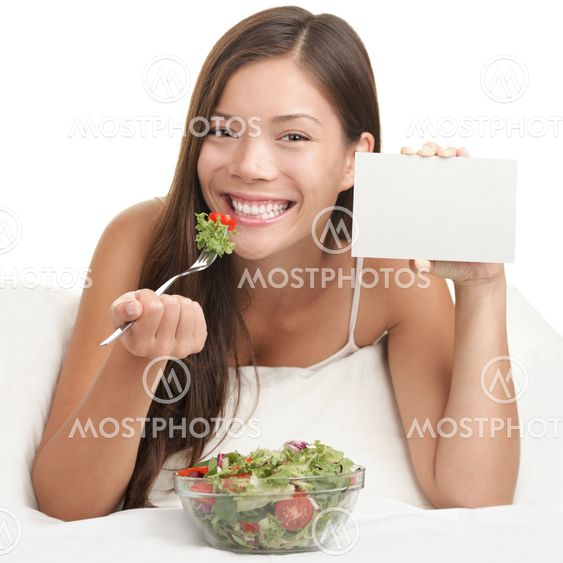 Woman Eating Salad showing copy space sign