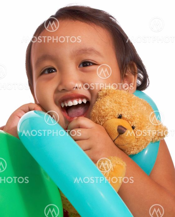 Happy Kid Holding A Teddy Bear