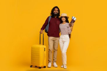 Couple with luggage ready for holiday travel