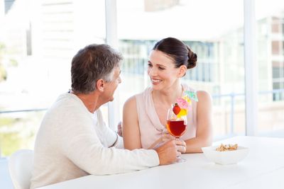 Happy couple drinking a glass 