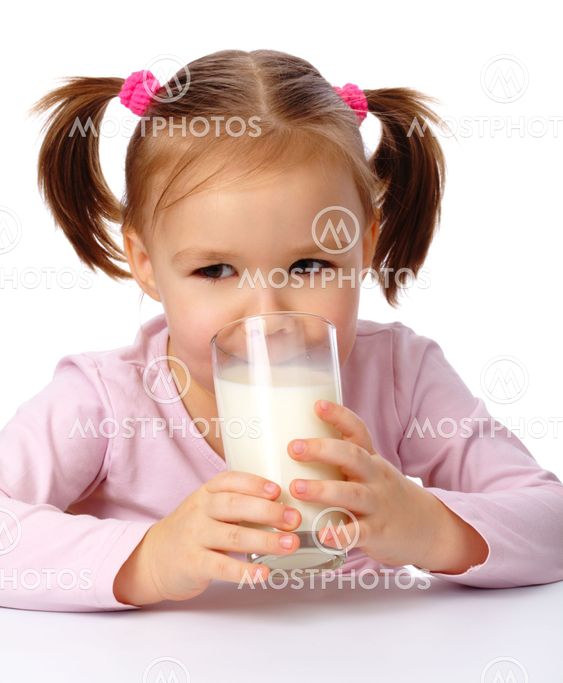Little girl drinks milk