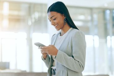 Businesswoman, typing and communication on phone in...