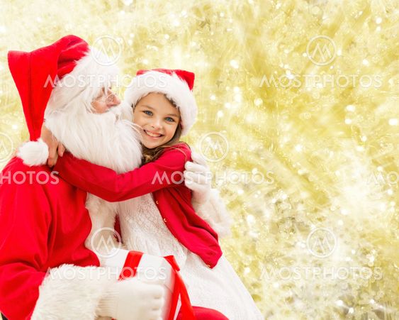 smiling little girl with santa claus