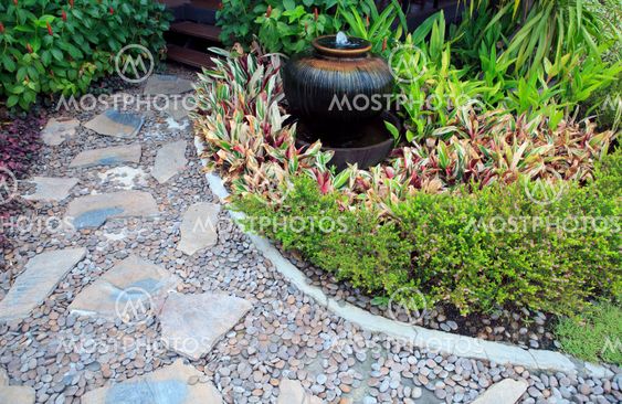 home garden with fountain jar