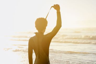 Zip, swimsuit and surfer ready to surf at the beach, sea...